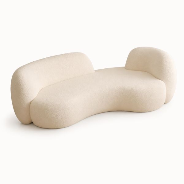 Cream bouclé lounge chair with curved silhouette